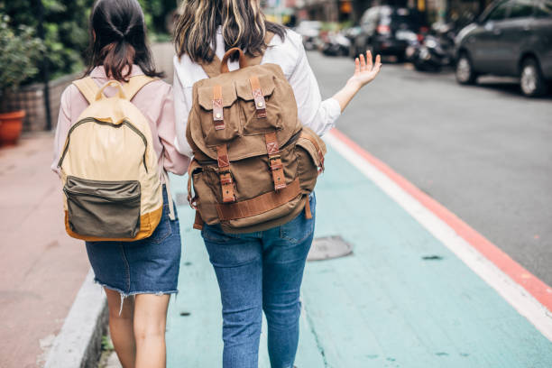 istock Two women students walking on the street 1151142523