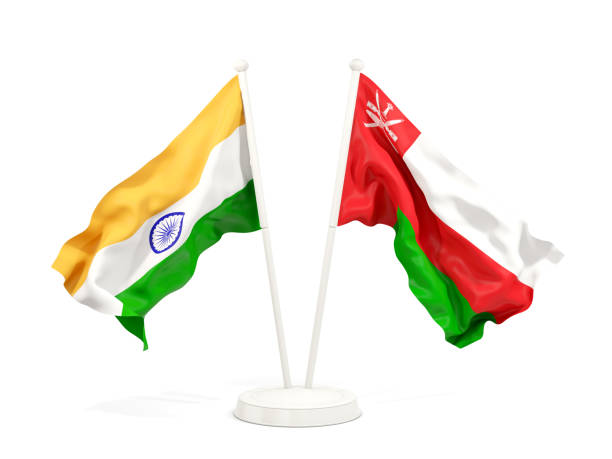 istock Two waving flags of India and oman isolated on white 1151144290