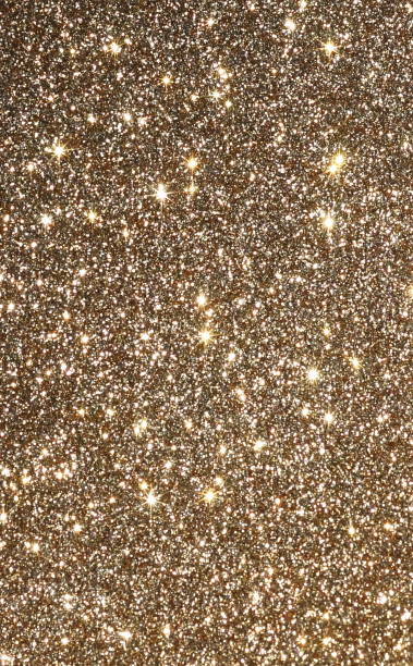 istock Christmas,  festive, holiday background. Abstract sparkles, shiny gold glitter background texture 1151145213