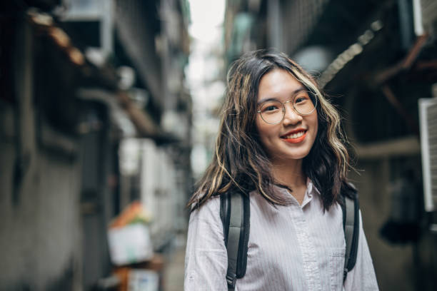 istock Charming young woman standing in alley downtown 1151145929