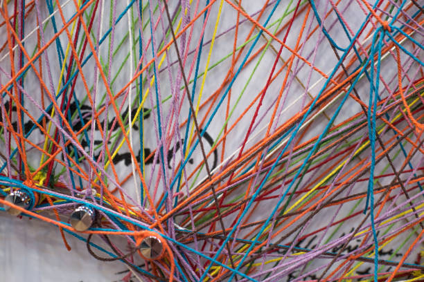 istock Colored tangled colorful needlecraft thread rope. weaving colors threads 1151145981