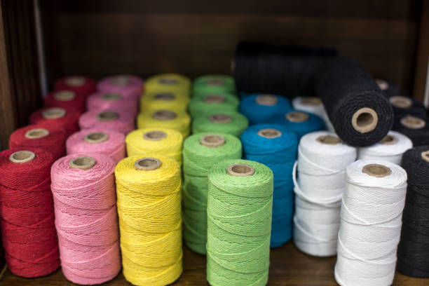 istock Set of colored threads for sewing on coils. 1151146003
