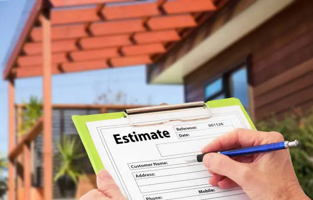 Photo of Hand Writing an Estimate for Home Building Renovation