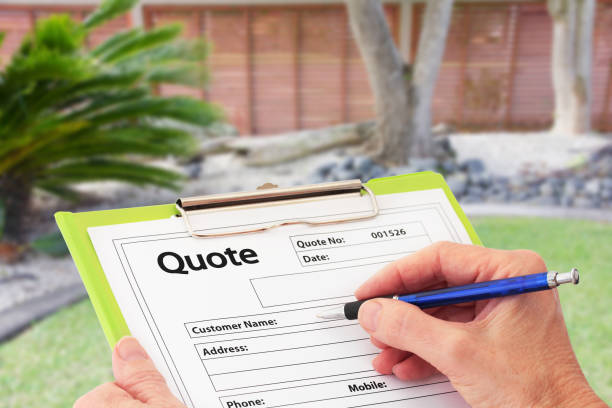 Hand Writing a Quote for Garden Maintenance stock photo