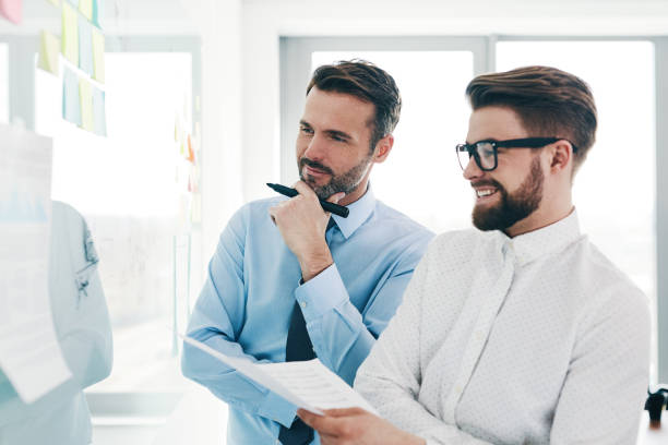 istock Business people working together at modern office discussing new project on whiteboard 1151151784