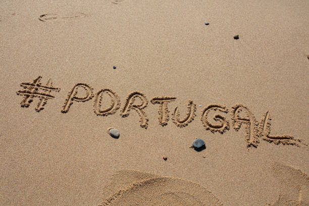istock hashtag written by hand in the sand 1151152112