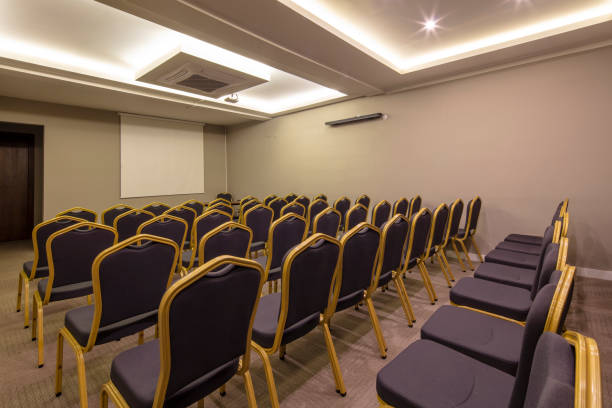 istock Seminar presentation. Empty conference room, lots of empty seats. Auditorium for workshops and seminars. Brown color. 1151152203