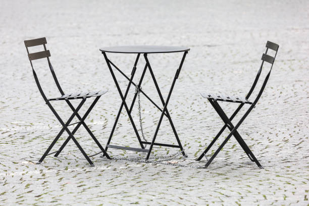 istock empty tables and chairs out side a street restaurant 1151152475
