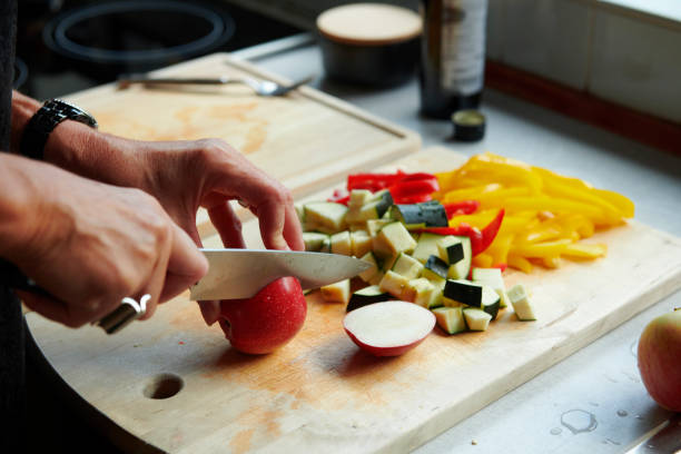 istock Woman preparing meal with vegetables 1151153164