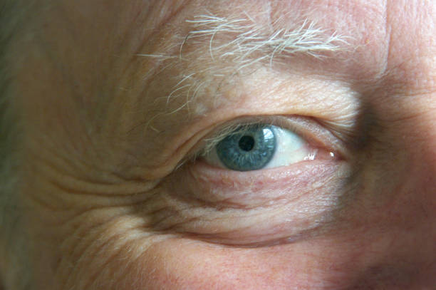 istock Eye of middle aged man - close up - looking towards camera 1151153309