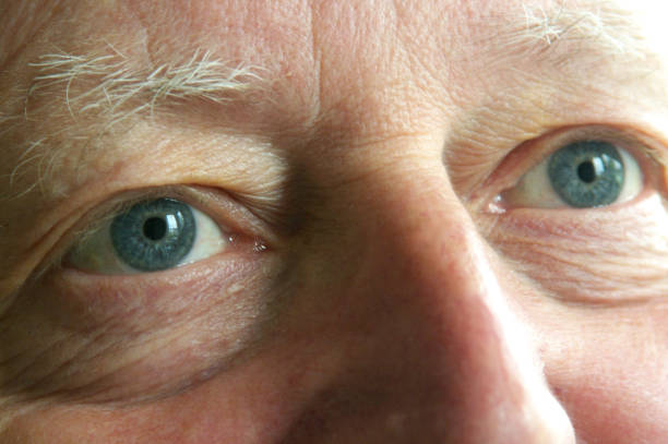 istock Eyes of middle aged man - close up - looking upwards 1151153318