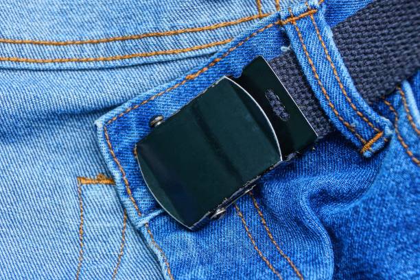 istock long black belt with a metal buckle on a blue denim 1151153461
