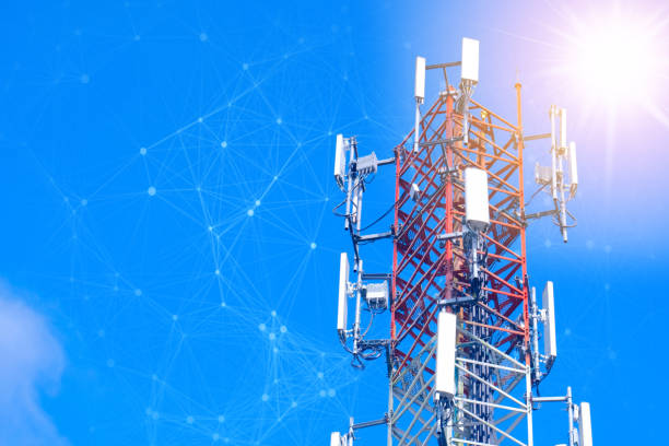 Cellular tower station for wireless telecommunication technology and blending with particles, glittering particles. Connection and mesh dots stock photo