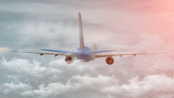 istock 3D rendering of a commercial airplane on flight over the clouds 1151159962