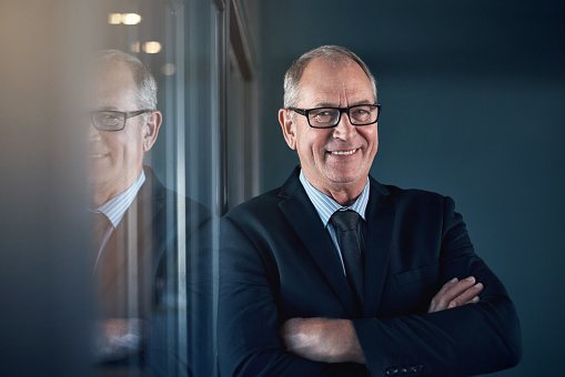 Portrait of a mature businessman standing in an office