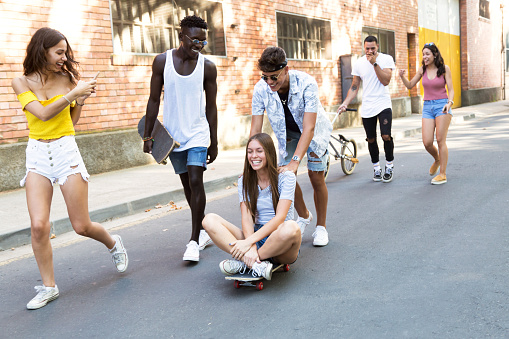 Portrait of group of active teenagers making recreational activity in an urban area.