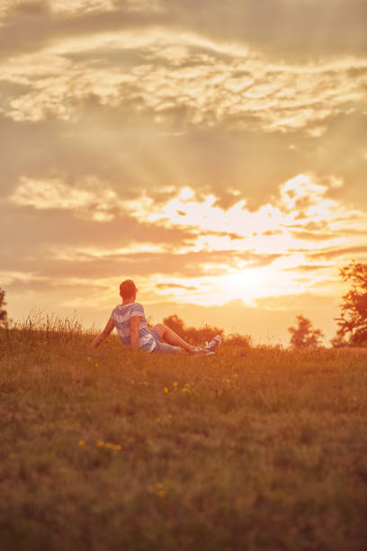 istock Man enjoying sunset/sunrise in nature. 1151163260