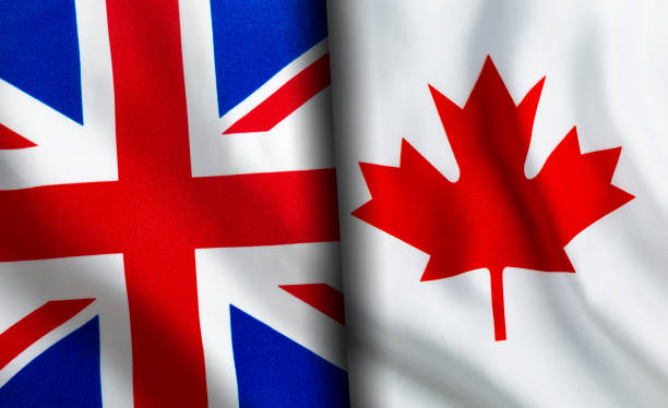istock British and Canadian flags standing side by side 1151164881