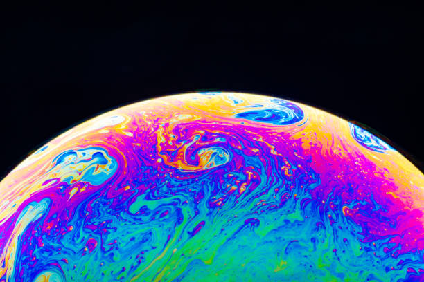 istock Macro shot of a soap bubble hemisphere. Abstract colorful liquid background. 1151165434