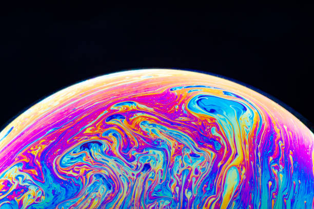 istock Macro shot of a soap bubble hemisphere. Abstract colorful liquid background. 1151165438