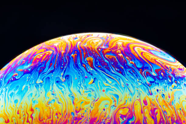 istock Macro shot of a soap bubble hemisphere. Abstract colorful liquid background. 1151165442