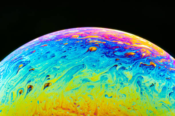 istock Macro shot of a soap bubble hemisphere. Abstract colorful liquid background. 1151165469