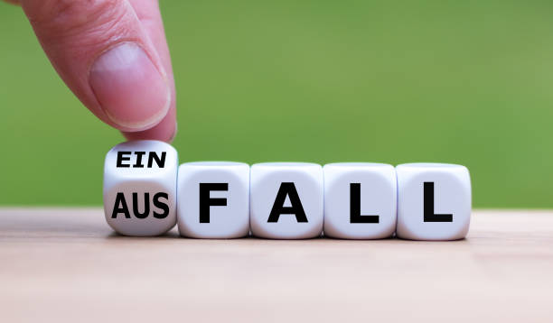 istock Hand turns a dice and changes the German word 