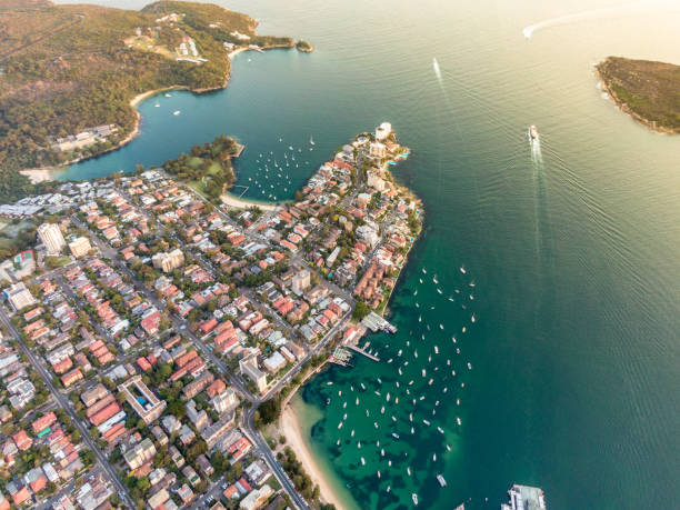 Aerial drone evening view of the Sydney suburb of Manly, a beach-side suburb of northern Sydney, in the state of New South Wales, Australia, with Manly Harbour, Little Manly Beach and Collins Beach. stock photo