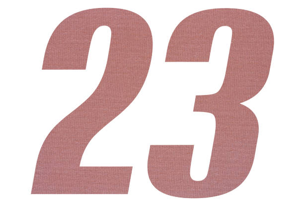 istock Number 23 with terracotta colored fabric texture on white background 1151170615