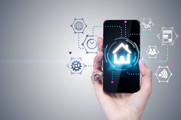 istock Woman hand with phone, smart home interface 1151177319