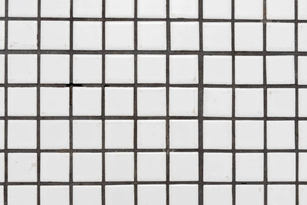 istock White dirty ceramic tiles wall or floor for background texture. 1151178814