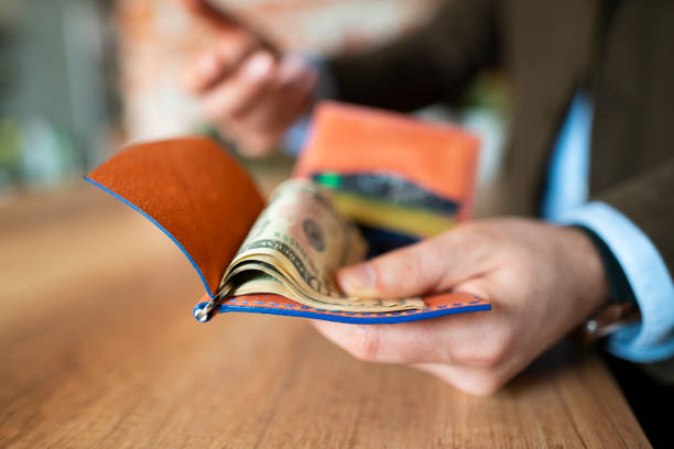 istock Keeping Cash In A Modern Wallet 1151180339