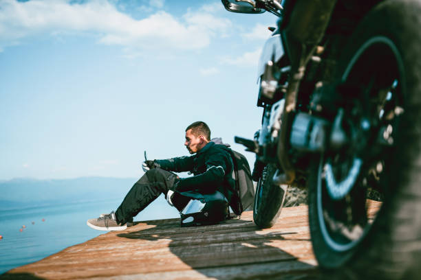 istock Motorcyclist Watching Map For Further Journey 1151182954