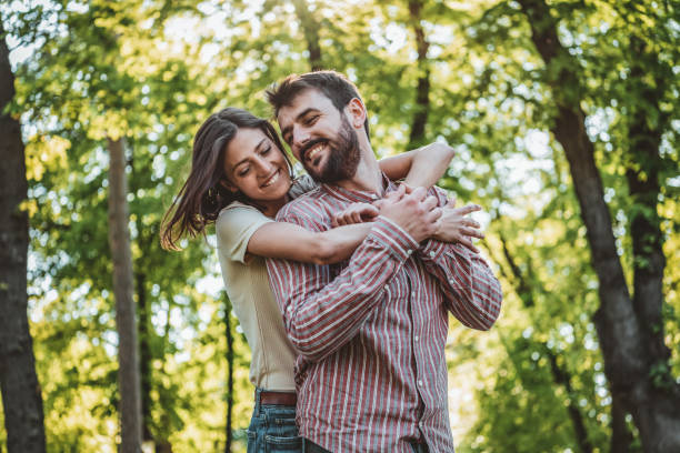 istock Young Couple is Enjoying Springtime in Park 1151186788