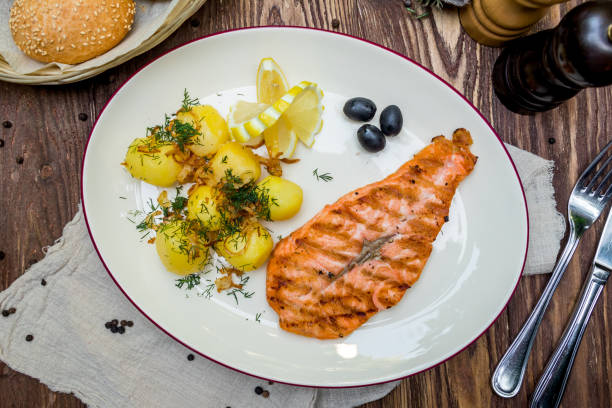 istock Salmon steak on the grill 1151186918