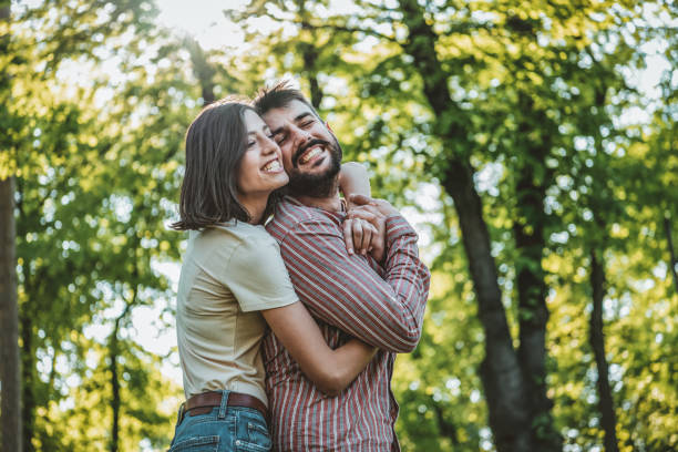 istock Young Couple is Enjoying Springtime in Park 1151187120