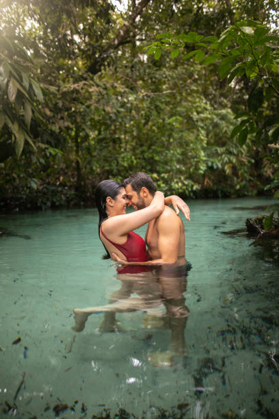 istock Couple embracing in Waterfall in Tocantins, Brazil 1151188442