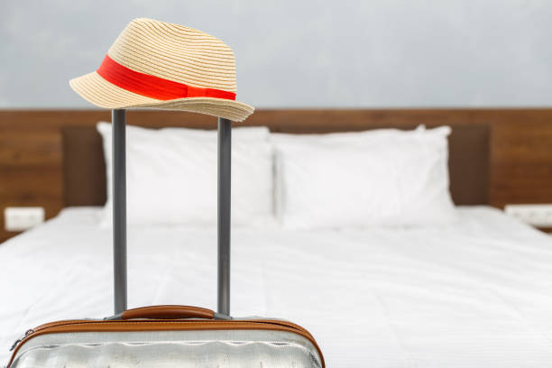 istock suitcase in light hotel room 1151189020