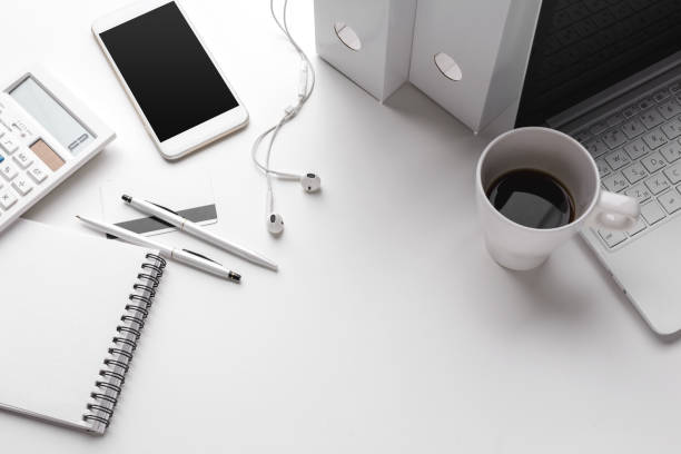 istock Business Items dropped in creative Disorder on white Table 1151189872