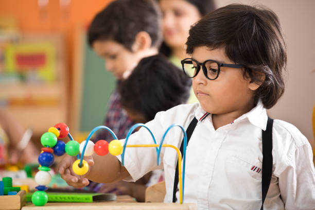 Little boy learning at preschool