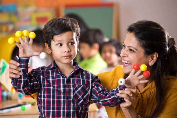 istock Teacher having fun with preschool boy 1151191572