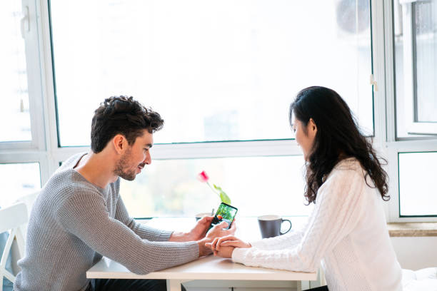 istock Couple choosing their best photo to post on internet 1151191752