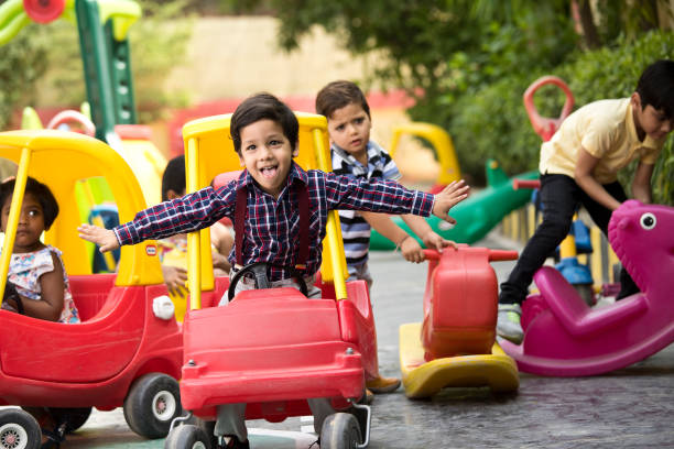 istock Children having fun playing on toy rides 1151191760