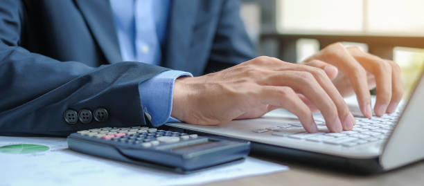 istock Businessman using laptop for analysis maketing plan, Manager calculate financial report and graph chart.  Business, Finance and Accounting concepts 1151192420