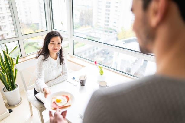 istock Unrecognizable man bringing breakfast to his girlfriend 1151192588