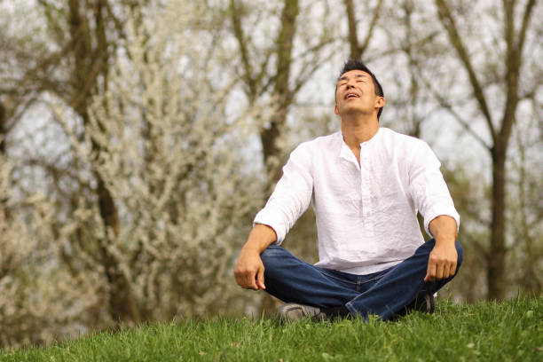 istock Japanese man sitting in nature 1151193311