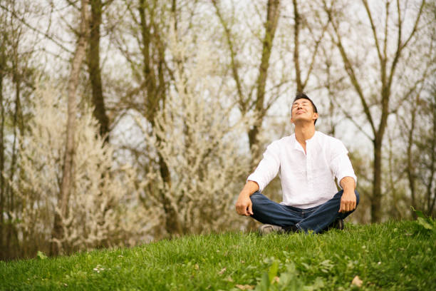 istock Japanese man sitting in nature 1151193347