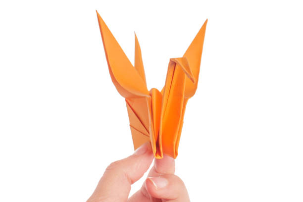 istock origami crane on white background 1151193349