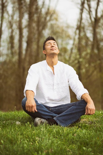 istock Japanese man sitting in nature 1151193388