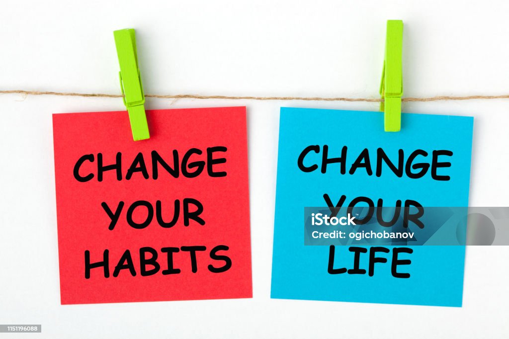 Change Habits Change Life Change Your Life by Changing Your Habits text written on color notes with wooden pinch. Addiction Stock Photo